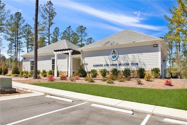 view of property featuring uncovered parking