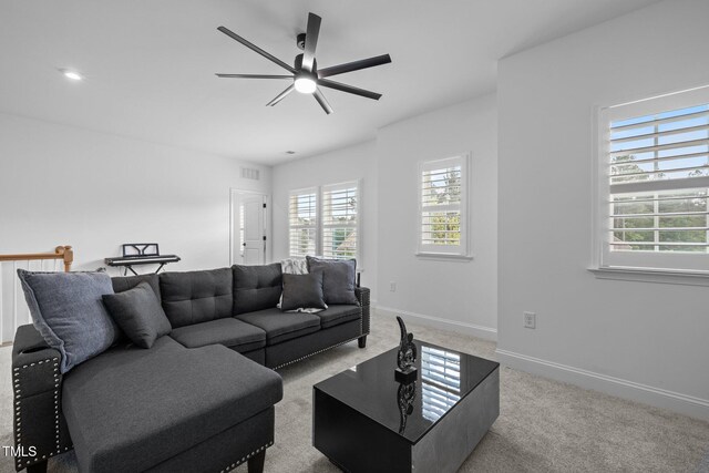 386 The Parks Dr, Pittsboro, NC 27312 - living room with light colored carpet, plenty of natural light, ceiling fan, and baseboards