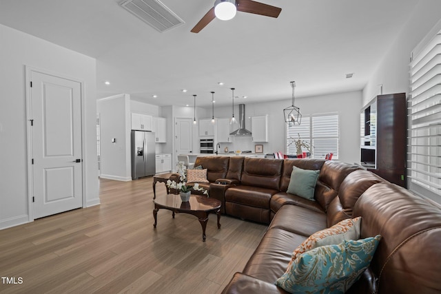 386 The Parks Dr, Pittsboro, NC 27312 - living area with a ceiling fan, light wood-style flooring, recessed lighting, and baseboards