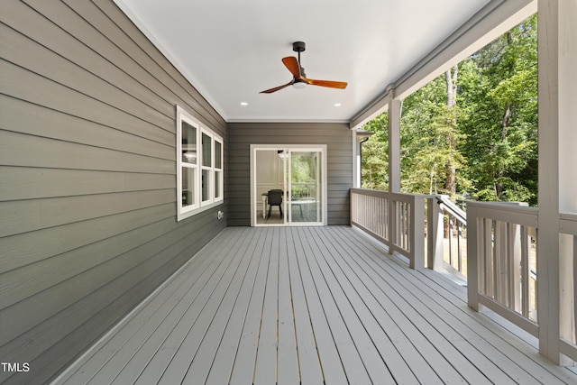 wooden deck with a ceiling fan