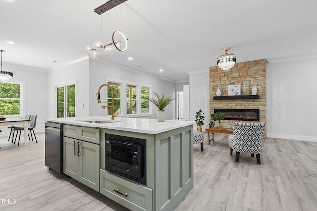 kitchen with stainless steel dishwasher, crown molding, an inviting chandelier, black microwave, and a sink