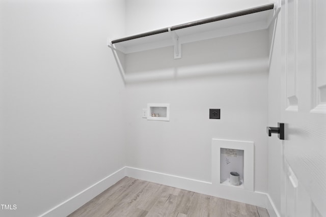 washroom featuring laundry area, electric dryer hookup, light wood-type flooring, baseboards, and hookup for a washing machine