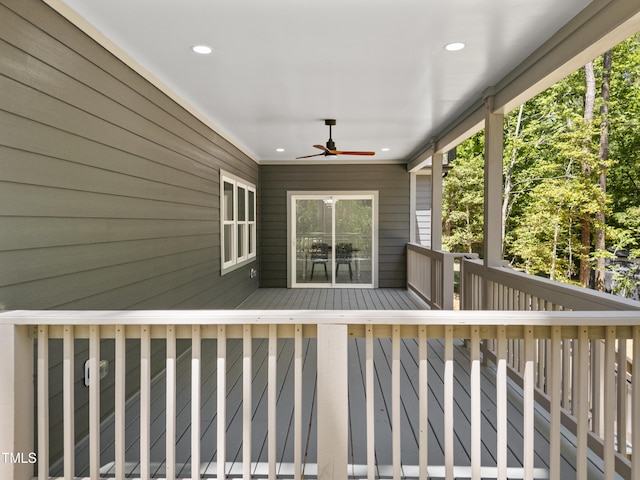 wooden terrace with a ceiling fan