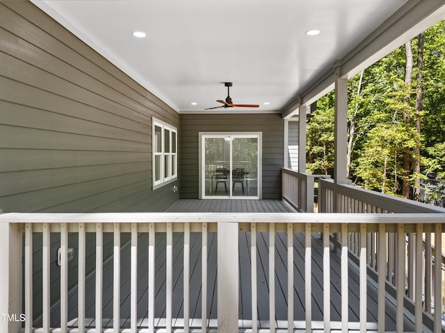 wooden deck featuring ceiling fan