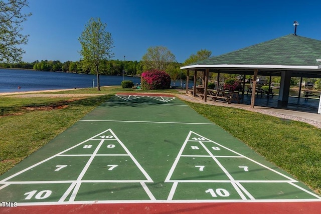 view of community with a lawn, a gazebo, and shuffleboard