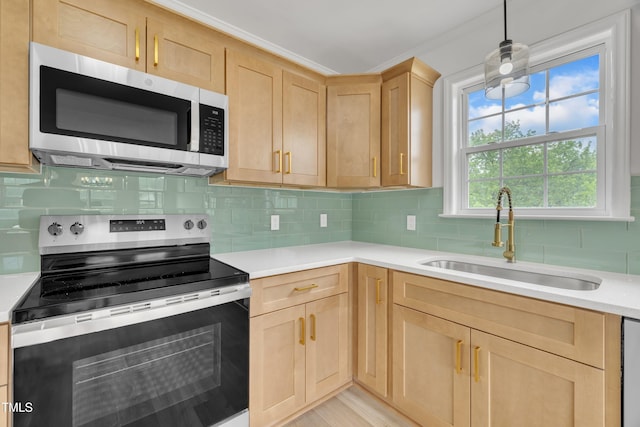 112 Edmondson Dr, Willow Springs, NC 27592 - kitchen with decorative backsplash, a sink, stainless steel appliances, light countertops, and light brown cabinetry