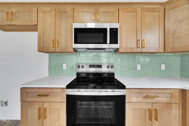 112 Edmondson Dr, Willow Springs, NC 27592 - kitchen featuring light countertops, backsplash, and appliances with stainless steel finishes
