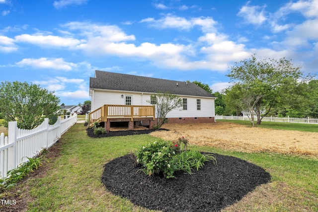 112 Edmondson Dr, Willow Springs, NC 27592 - rear view of property featuring a lawn, a deck, crawl space, and a fenced backyard