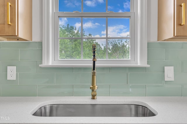 112 Edmondson Dr, Willow Springs, NC 27592 - details featuring light stone counters, tasteful backsplash, and a sink