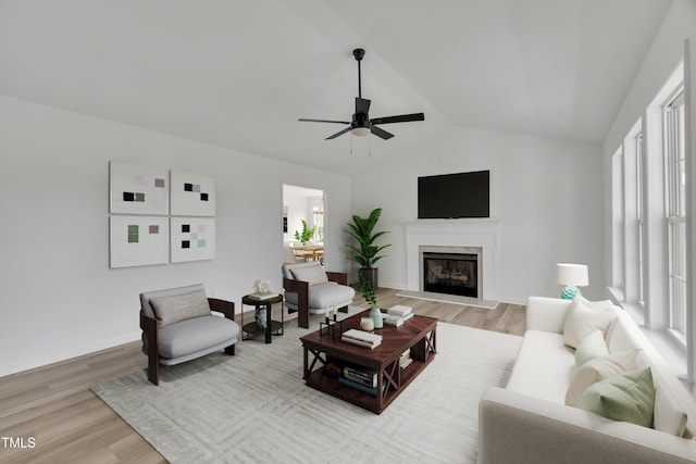112 Edmondson Dr, Willow Springs, NC 27592 - living area with a high end fireplace, lofted ceiling, ceiling fan, and wood finished floors