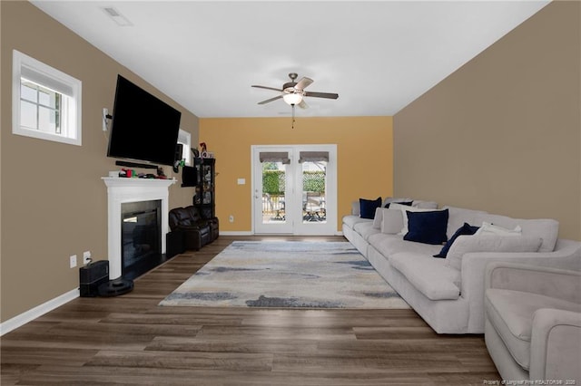504 Loom Dr, Fayetteville, NC 28306 - living room featuring ceiling fan, a glass covered fireplace, plenty of natural light, and wood finished floors