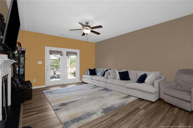 504 Loom Dr, Fayetteville, NC 28306 - living area featuring ceiling fan, wood finished floors, a glass covered fireplace, and baseboards