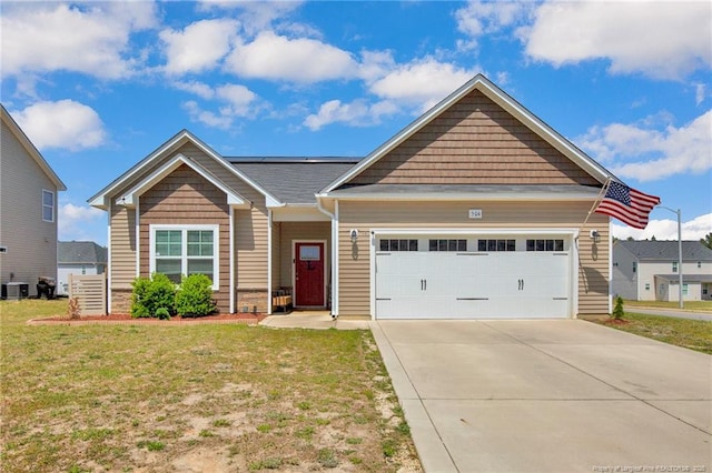 504 Loom Dr, Fayetteville, NC 28306 - craftsman house featuring a front lawn, an attached garage, concrete driveway, and cooling unit