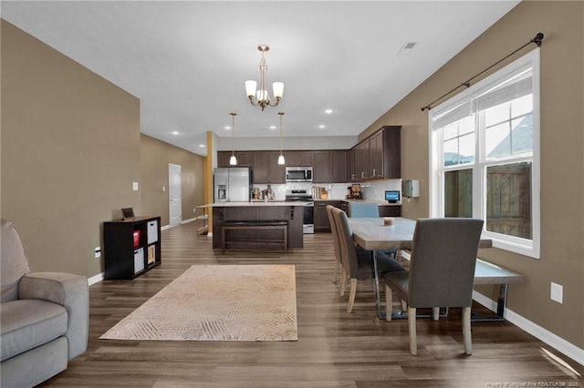 504 Loom Dr, Fayetteville, NC 28306 - dining room featuring a chandelier, baseboards, dark wood finished floors, and recessed lighting