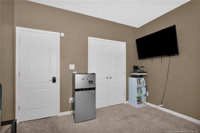 504 Loom Dr, Fayetteville, NC 28306 - unfurnished bedroom featuring freestanding refrigerator, carpet flooring, and baseboards