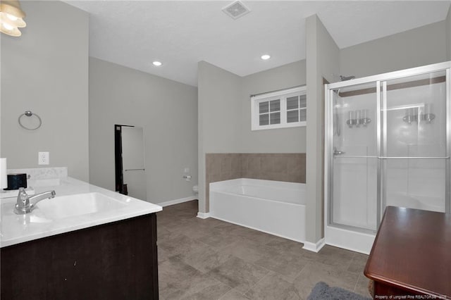 504 Loom Dr, Fayetteville, NC 28306 - full bathroom with baseboards, a shower stall, a garden tub, and vanity