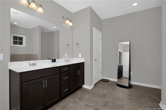 504 Loom Dr, Fayetteville, NC 28306 - full bath with baseboards, double vanity, and recessed lighting
