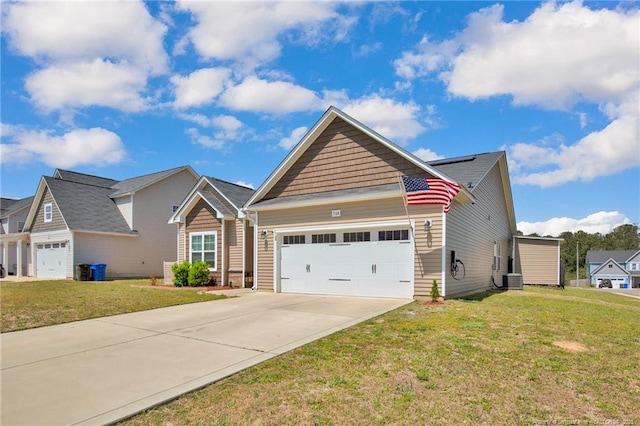 504 Loom Dr, Fayetteville, NC 28306 - craftsman-style home with an attached garage, concrete driveway, a front lawn, and roof mounted solar panels