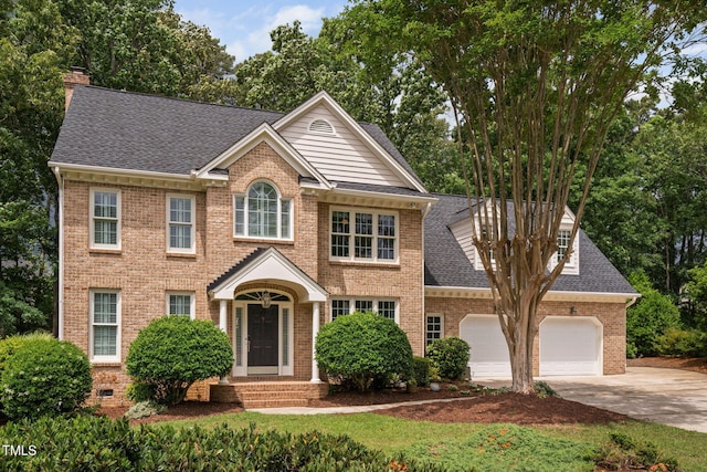 108 Nimbus Ct, Cary, NC 27513 - view of front of home featuring brick siding, roof with shingles, driveway, a garage, and a chimney