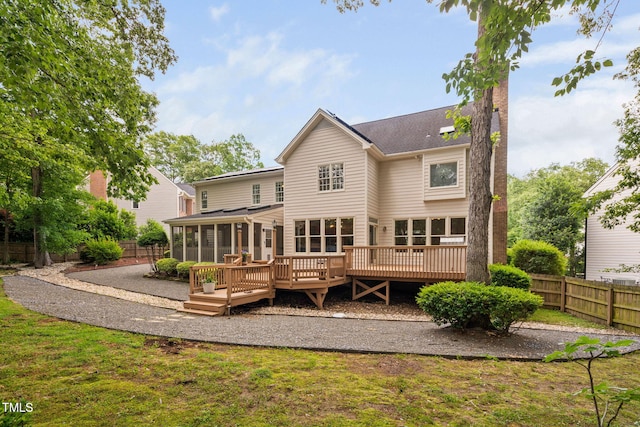 108 Nimbus Ct, Cary, NC 27513 - back of house with a sunroom, fence, a wooden deck, and a chimney