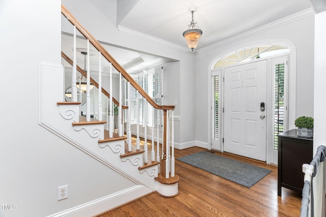 108 Nimbus Ct, Cary, NC 27513 - entrance foyer with wood finished floors, stairs, crown molding, and baseboards