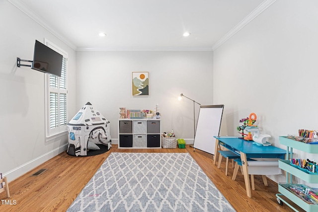 108 Nimbus Ct, Cary, NC 27513 - playroom featuring ornamental molding, wood finished floors, baseboards, and recessed lighting