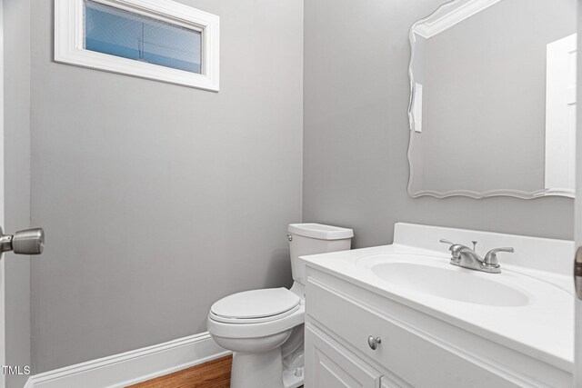 108 Nimbus Ct, Cary, NC 27513 - bathroom with toilet, wood finished floors, vanity, and baseboards