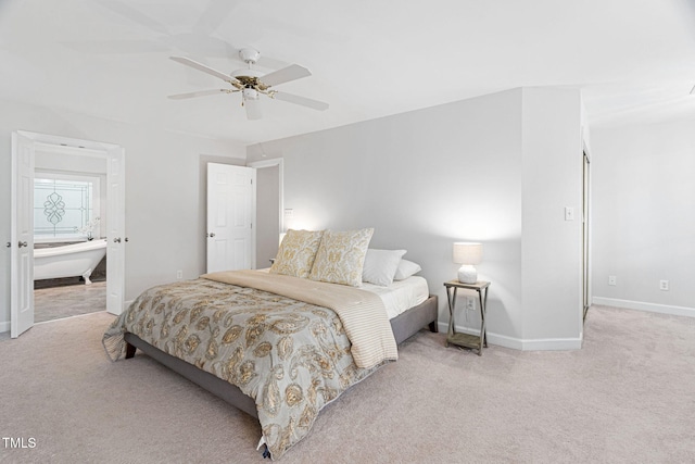 108 Nimbus Ct, Cary, NC 27513 - bedroom with light carpet, baseboards, ensuite bathroom, and a ceiling fan