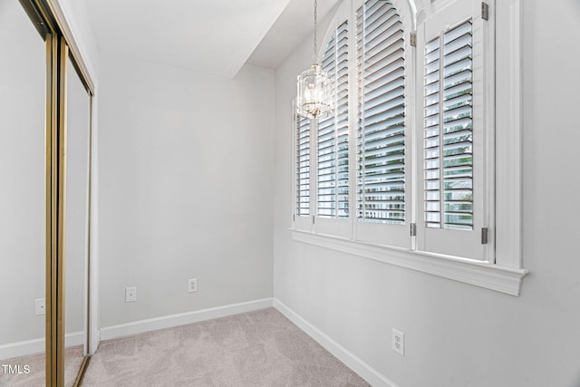 108 Nimbus Ct, Cary, NC 27513 - unfurnished bedroom featuring a chandelier, carpet flooring, and baseboards