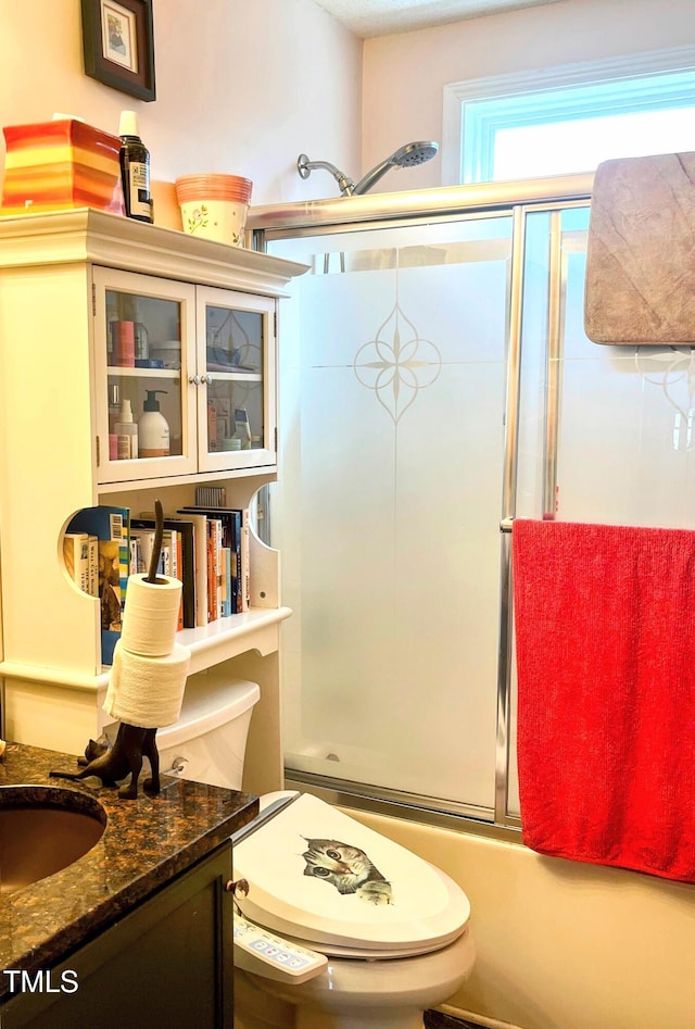 full bath with toilet and vanity