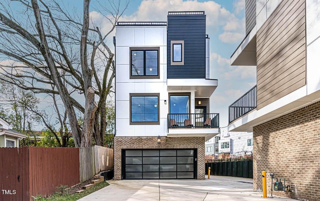 211 W Coporation, Durham, NC 27701 - contemporary home with brick siding, an attached garage, driveway, and a balcony