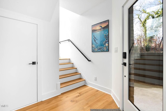 211 W Coporation, Durham, NC 27701 - entrance foyer featuring light wood-style floors, stairway, and baseboards