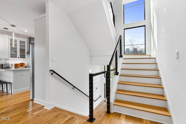 211 W Coporation, Durham, NC 27701 - stairs featuring wood finished floors, recessed lighting, and baseboards