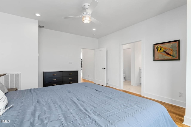 211 W Coporation, Durham, NC 27701 - bedroom with light wood-type flooring, baseboards, recessed lighting, ensuite bath, and a ceiling fan