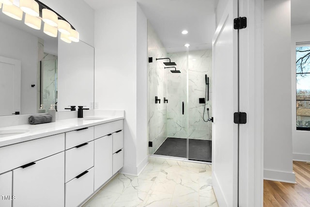 211 W Coporation, Durham, NC 27701 - bathroom featuring baseboards, a marble finish shower, double vanity, recessed lighting, and marble finish floors