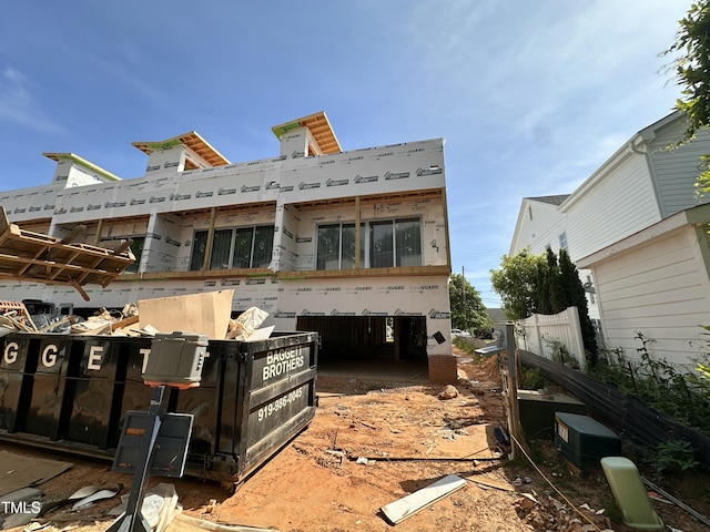 back of house with central air condition unit and fence