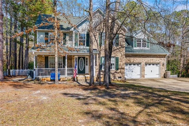 51 Sandy Pt, Sanford, NC 27332 - view of front facade with driveway, covered porch, fence, a garage, and brick siding