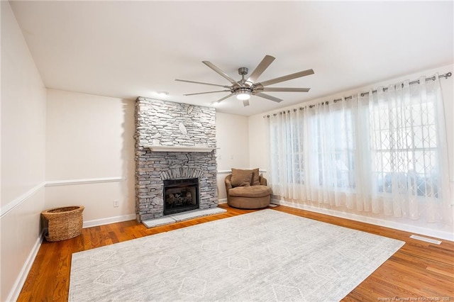51 Sandy Pt, Sanford, NC 27332 - living room with wood finished floors, visible vents, baseboards, a fireplace, and ceiling fan