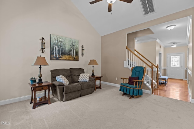 1813 Turning Plow Ct, Holly Springs, NC 27540 - living room with a ceiling fan, carpet, stairs, crown molding, and high vaulted ceiling