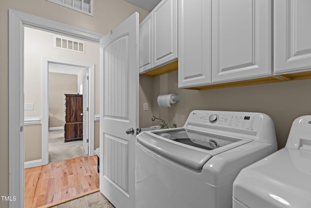 1813 Turning Plow Ct, Holly Springs, NC 27540 - laundry room with separate washer and dryer and cabinet space