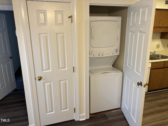 3601 Helix Ct Unit 301, Raleigh, NC 27606 - laundry room featuring stacked washer / drying machine and dark wood finished floors