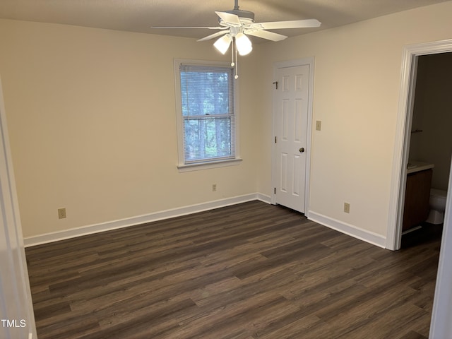 3601 Helix Ct Unit 301, Raleigh, NC 27606 - unfurnished bedroom featuring dark wood-type flooring, baseboards, and ceiling fan