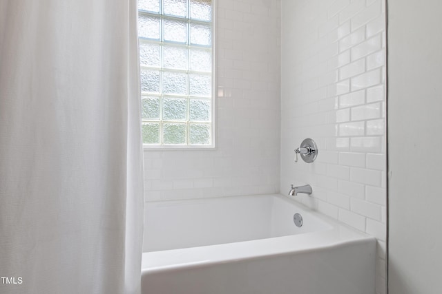 bathroom featuring shower / bathtub combination with curtain