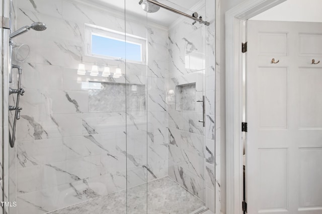 bathroom featuring a marble finish shower and ornamental molding