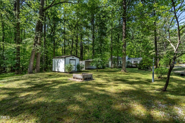 107 Piquot Dr, Louisburg, NC 27549 - view of yard with an outbuilding and a shed