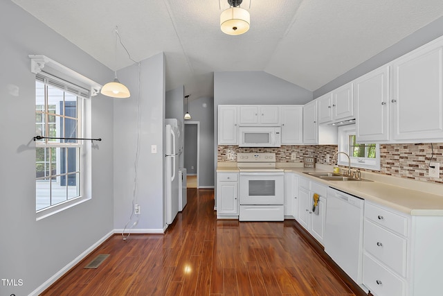 107 Piquot Dr, Louisburg, NC 27549 - kitchen featuring a sink, decorative backsplash, white appliances, lofted ceiling, and visible vents