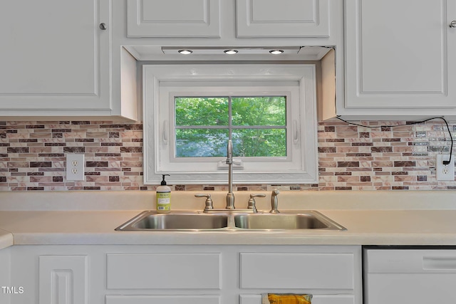 107 Piquot Dr, Louisburg, NC 27549 - kitchen with white cabinets, decorative backsplash, white dishwasher, and light countertops