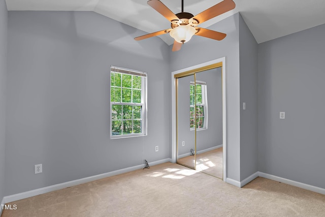 107 Piquot Dr, Louisburg, NC 27549 - unfurnished bedroom featuring vaulted ceiling, a ceiling fan, a closet, baseboards, and carpet flooring