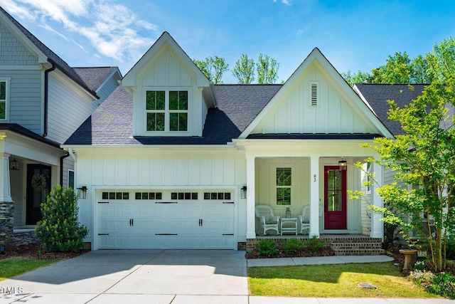 83 Vandalia Ave, Chapel Hill, NC 27516 - modern farmhouse with board and batten siding, a porch, roof with shingles, and concrete driveway