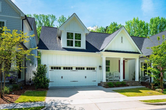83 Vandalia Ave, Chapel Hill, NC 27516 - modern farmhouse featuring board and batten siding, roof with shingles, and covered porch